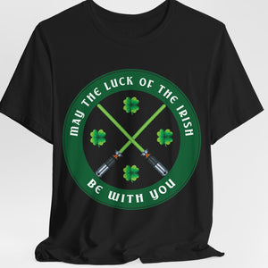 A black t-shirt with a graphic design featuring crossed lightsabers and text 'MAY THE LUCK OF THE IRISH BE WITH YOU' on a circular green background.