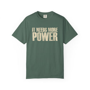 Green t-shirt with IT NEEDS MORE POWER text on a white background