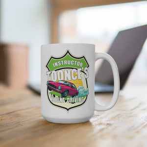 A white ceramic mug with a colorful graphic design featuring a pink car and the text 'Instructor Toonce's Stunt Driving'.