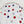 Polka dot shower curtain with red, blue, and gray dots on a white background