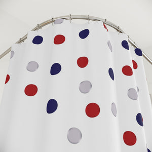 Polka dot shower curtain with red, blue, and gray dots on a white background