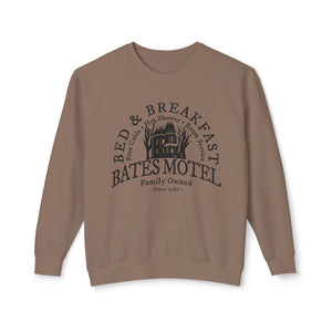 Yellow sweatshirt with 'Bates Motel Halloween Fall' design on a plain background