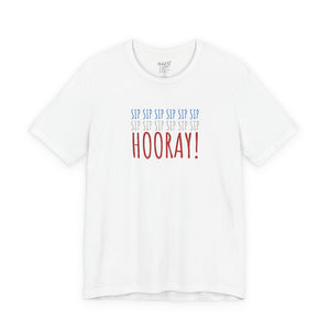 White t-shirt with embroidered red white and blue text design on a white background