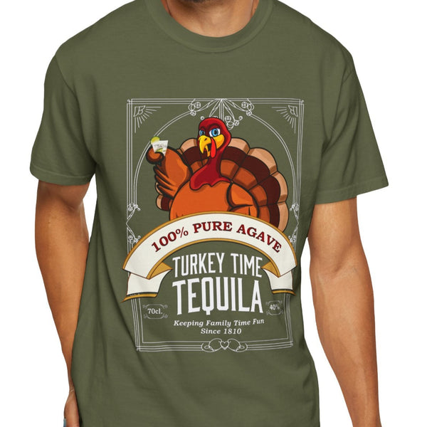 Man wearing a green t-shirt with a tequila-themed graphic design on a white background