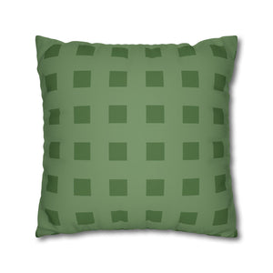 Green checkered pillow on a white background