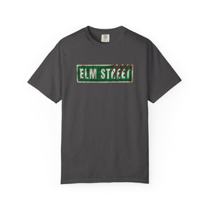 Grey t-shirt featuring a distressed green 'ELM STREET' sign graphic printed on the chest.