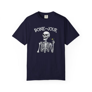 Navy t-shirt with a graphic of a skeleton holding a martini with Bone-Jour in bone style lettering at the top.