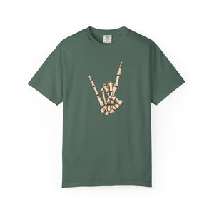 Green t-shirt with skeleton hand making 'rock on' gesture on a white background