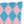 Decorative pillow with blue and pink diamond pattern on a white background