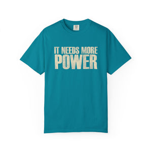 Teal t-shirt with 'IT NEEDS MORE POWER' text on a white background