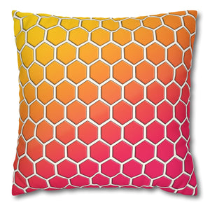 A square accent pillow with a multicolored honeycomb pattern in shades of yellow, orange, and pink.