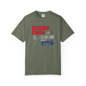  Green t-shirt with 'Kicking Kings to the Curb since 1776' text and graphics on a white background.