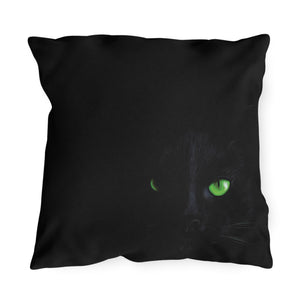 Plaid pillow with green and black pattern on a white background