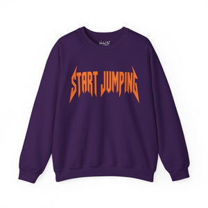 A purple crewneck sweatshirt featuring the phrase 'START JUMPING' printed across the chest in a stylized orange font resembling the Metallica logo, shown on a plain white background.