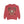 Red sweatshirt with a festive design featuring a Santa-like character and text on a white background