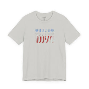 White t-shirt with embroidered red white and blue text design on a white background