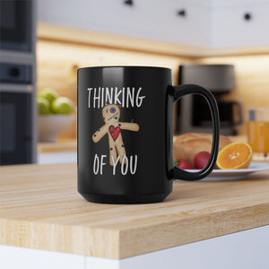 mug with 'Thinking of You Voodoo Doll Funny' graphic on a white background