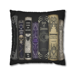 A square black throw pillow featuring a gothic book spine collage print with titles like  Book of Shadows, and Inception.