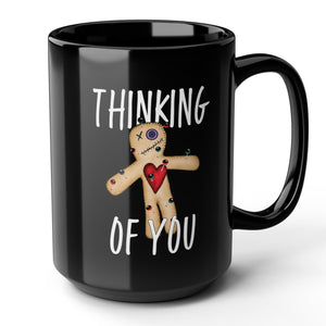mug with 'Thinking of You Voodoo Doll Funny' graphic on a white background