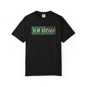 Black t-shirt featuring a distressed green 'ELM STREET' sign graphic printed on the chest.