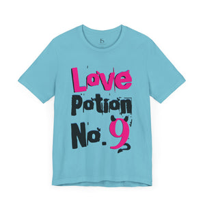Charity pink t-shirt with 'Love Potion No 9 Witchy Woman' design on a white background