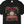 Black t-shirt with colorful graphic design featuring holiday moonshine design and text on a white background