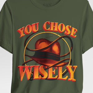 Person wearing a black t-shirt with '80s Movies Pop Culture Action Novelty' design on a plain background
