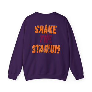 A purple crewneck sweatshirt shown from the back, featuring the text 'SHAKE THE STADIUM' printed in a distressed orange and red font.