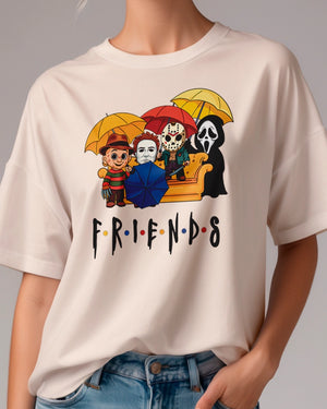 T-shirt with Halloween 'Friends' graphic featuring 80s horror characters under umbrellas on a gray background