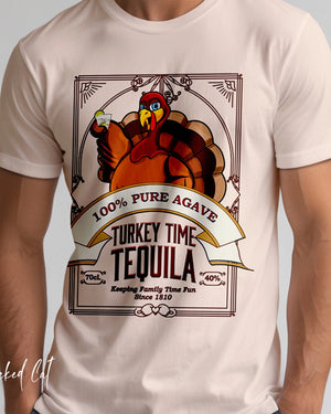 White holiday t-shirt with a turkey-themed tequila label design on a plain background