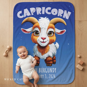 Baby on a blanket with Capricorn design and personalized text