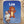 Baby lying on a blue blanket with a cartoon lion and personalized text