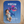 Baby lying on a blue blanket with Pisces design and personalized text