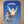 Baby on a blue blanket with a cartoon dove and 'Virgo' text, sitting on a wooden floor.