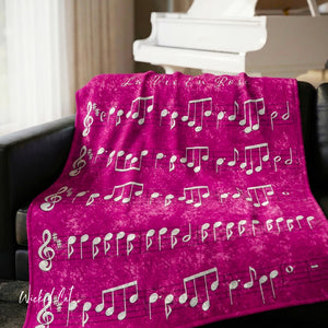 Soft sherpa blanket with 'La Vie En Rose Sheet Music Pink Decorative Throw' design