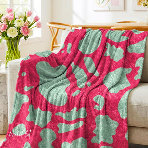 Soft sherpa blanket with 'Pink & Mint Green Animal Print Decorative Throw' design