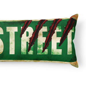 A rectangular lumbar pillow featuring a distressed green street sign design with the word 'STREET' in large white letters and three dark red claw marks across the center, shown on a white background.