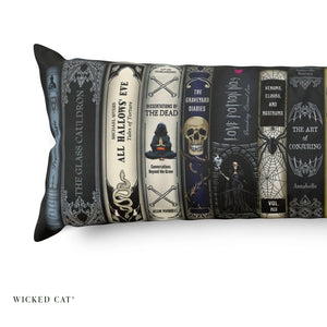 Close up of a decorative body pillow with a row of Halloween books design.