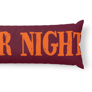 A rectangular lumbar pillow in dark burgundy with distressed orange text reading 'R NIGHT' across the front, shown on a clean white background.