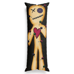 A tall, narrow body pillow featuring a voodoo doll design with a tan stitched figure, a red heart, and colorful pins on a black background.