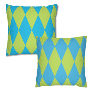 Two green and blue patterned pillows on a white background