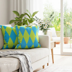 Decorative pillows with blue and green diamond pattern on a white sofa in a bright living room.
