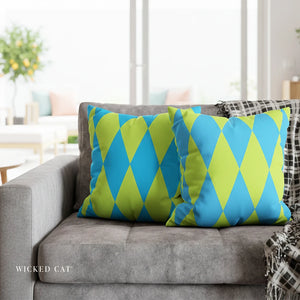 Gray sofa with blue and green patterned cushions in a blurred living room setting