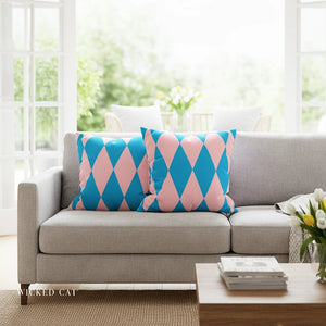 Gray sofa with pink and blue patterned cushions in a bright living room.