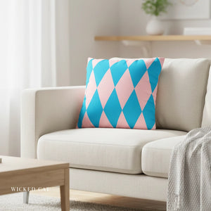 Decorative pillow with pink and blue diamond pattern on a beige sofa in a living room.