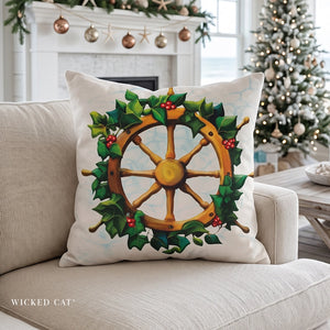 Decorative pillow with a ship's wheel and holly design on a cream sofa in a beach themed Christmas living room.