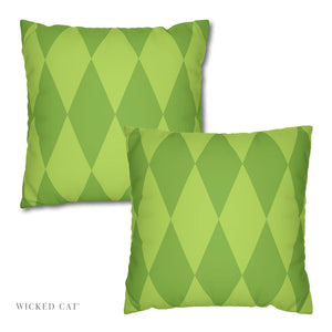 Two green patterned pillows on a white background with 'Wicked Cat' branding.