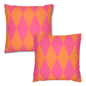 Two pink and orange patterned pillows on a white background
