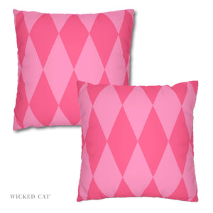 Two pink harlequin patterned pillows on a white background with 'Wicked Cat' branding.