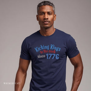 Man wearing a navy blue t-shirt with colorful text on a plain background